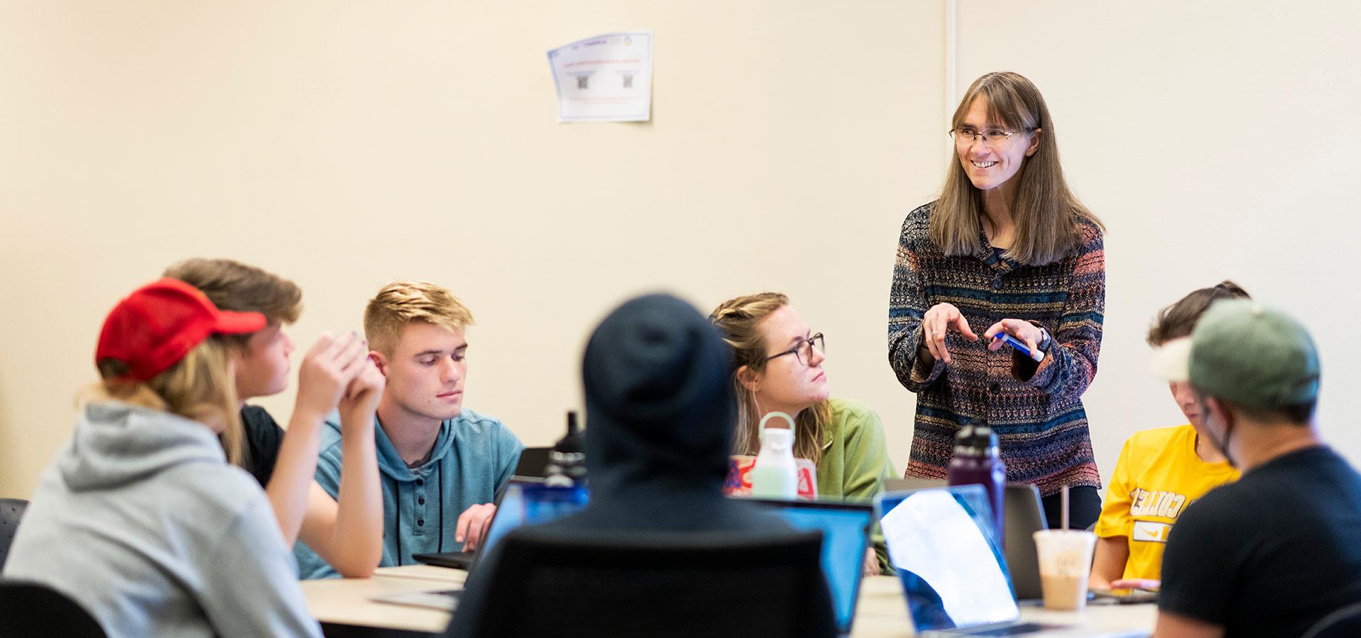 Students work as a group during Marion Hourdequin's Block 6 EV282 Contesting Climate Justice class on 3/15/23 where they debated climate policy. Photo by Lonnie Timmons III / Colorado College.